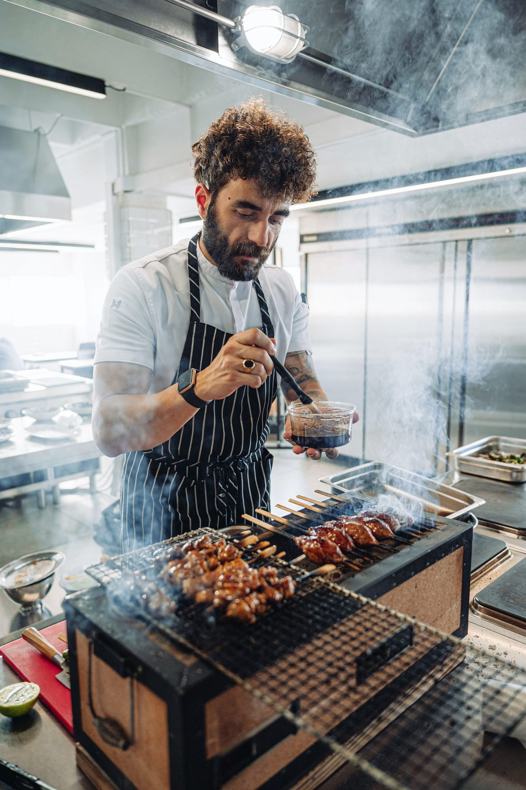 Alsi Sinanaj cooking Mediterranean lamb in wood oven